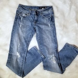 Light wash distressed denim jeans